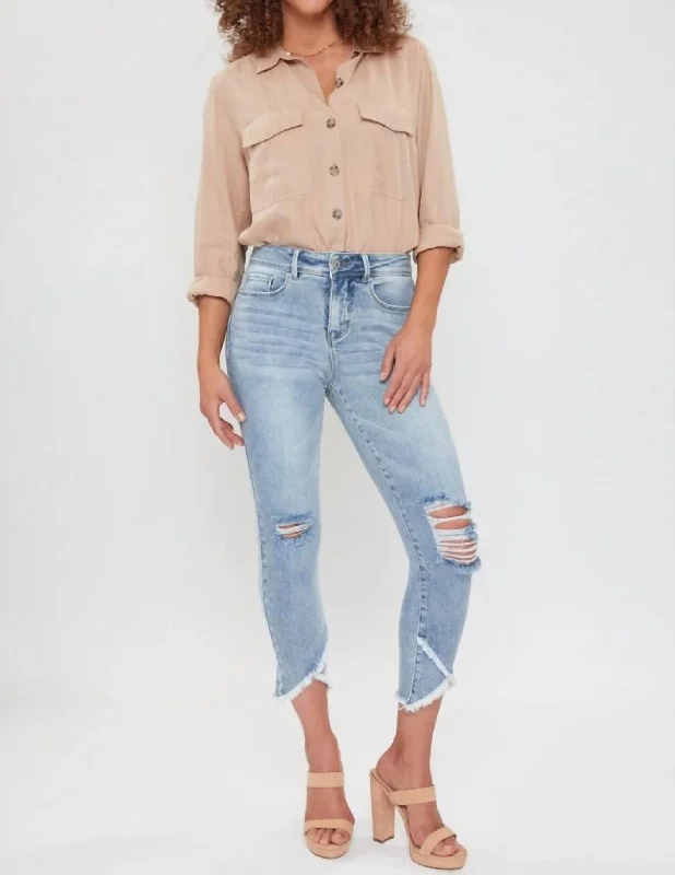 Dark wash jeans with whiskering and fading at the thighsMissy Petite Tulip Hem Ankle Jean In Ripped Medium Wash