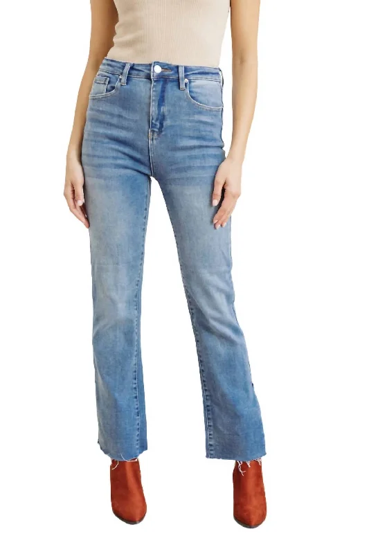 Jeans with a faux leather patch at the back pocketSlim Flare Side Slit Jeans In Medium Wash