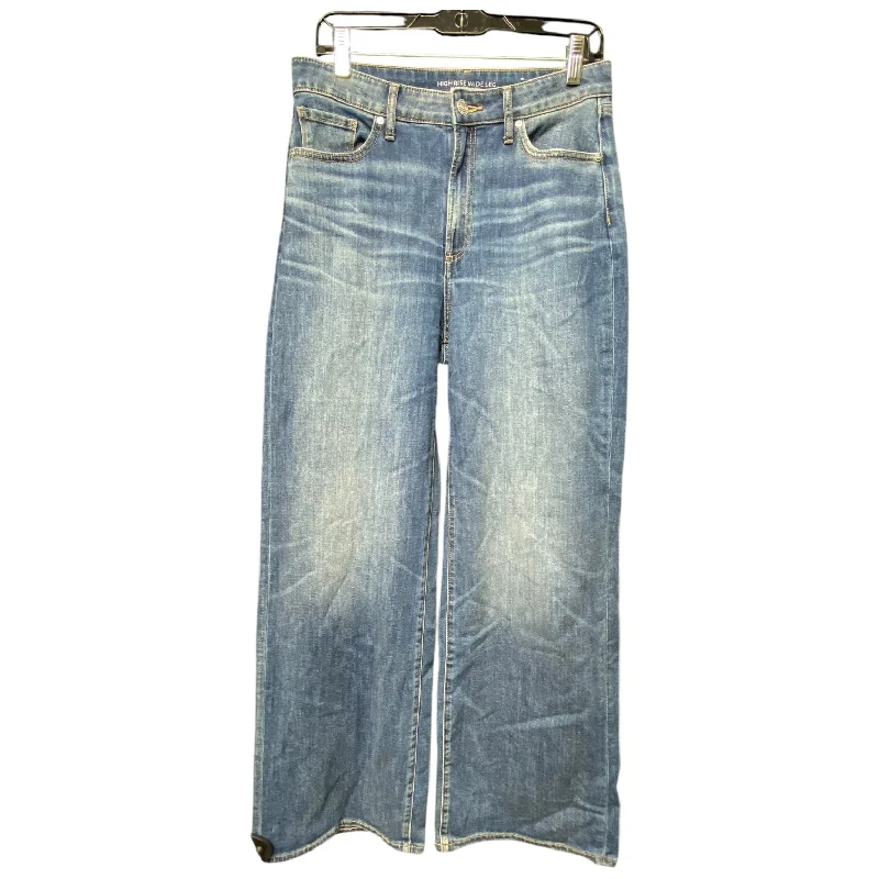 Light wash jeans with rips and tears for a casual vibeJeans Wide Leg By Chicos In Blue Denim, Size: 8