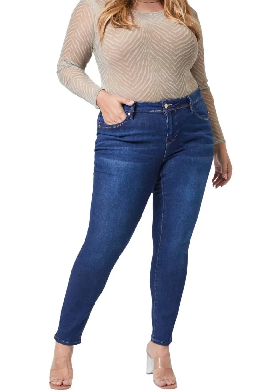 Skinny jeans with rips and tears for an edgy lookJunior Plus Wannabettabutt Mid-Rise Skinny Jean In Dark Indigo