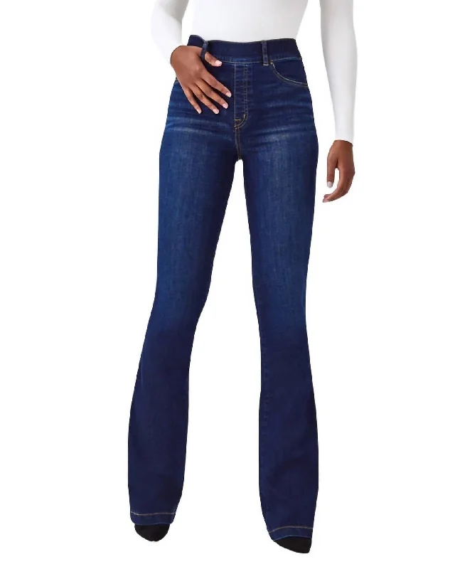 Dark denim jeans with subtle cat-eye fadesFlare Jean In Midnight Shade